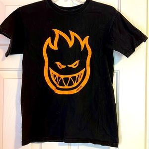 Black T shirt orange Spitfire emblem.